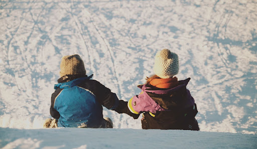Kids playing together in the snow in Iceland
