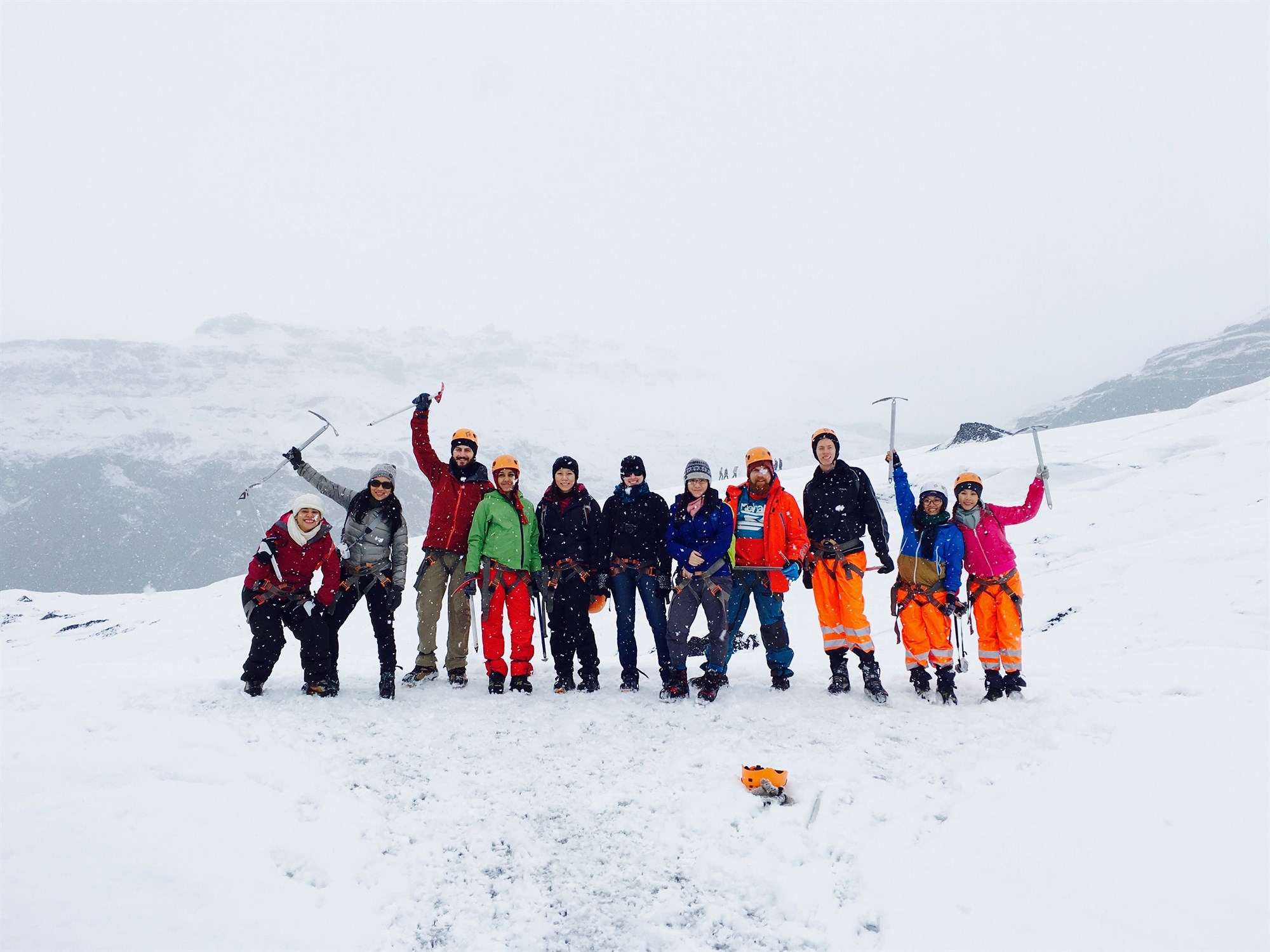 Group of people stood on a snowy mountain