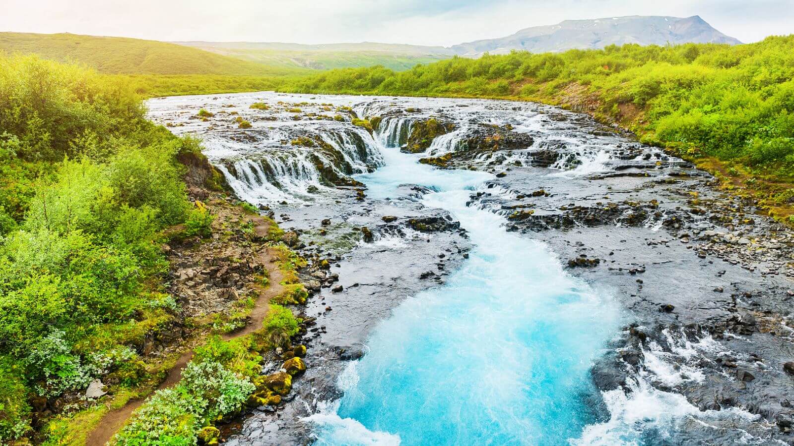 Turquoise waters of Bruarfoss waterfall in Iceland.