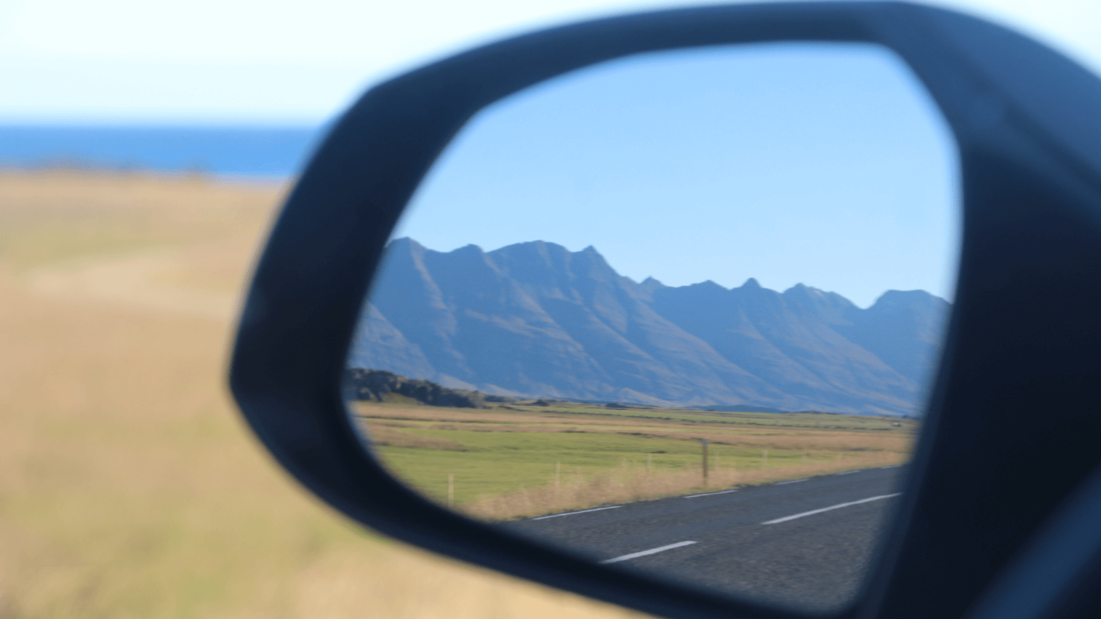 Side mirror on a car in Iceland. 