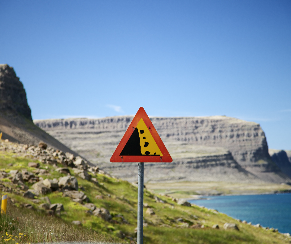 Warning road sign warning of falling rocks in Iceland.